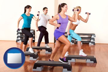 an exercise class at a gym - with Colorado icon